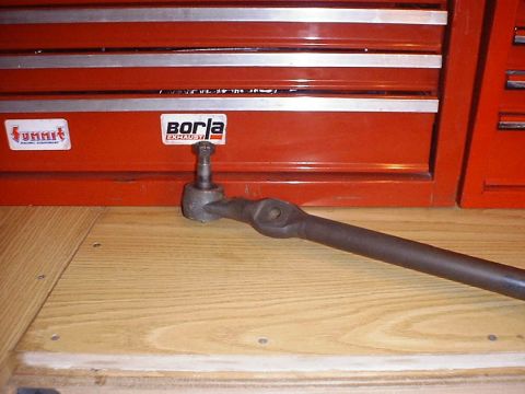 1988 Ford Bronco - A tie rod end is shown with stickers from Borla and Summit Racing Equipment on a red toolbox.