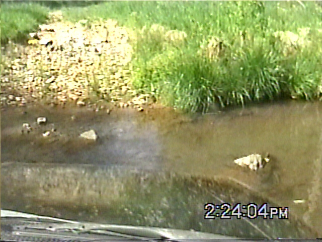 1988 Ford Bronco driving through water