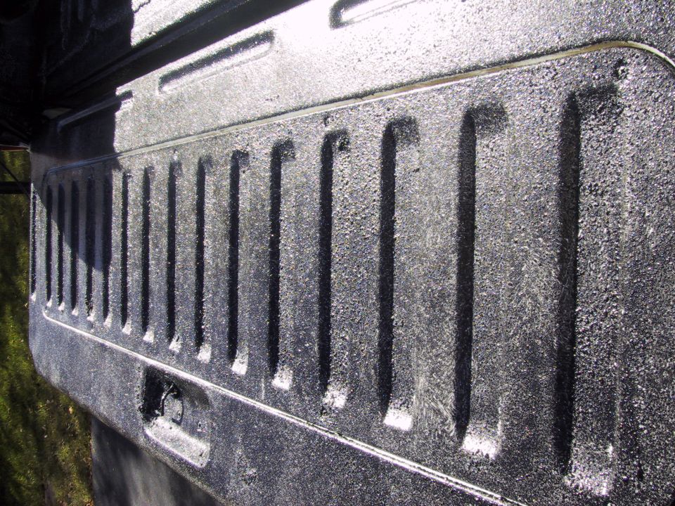 close-up of textured truck bed liner with vertical ridges