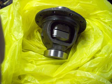 1988 Ford Bronco - A close-up view of a differential carrier, partially obscured by a yellow bag.