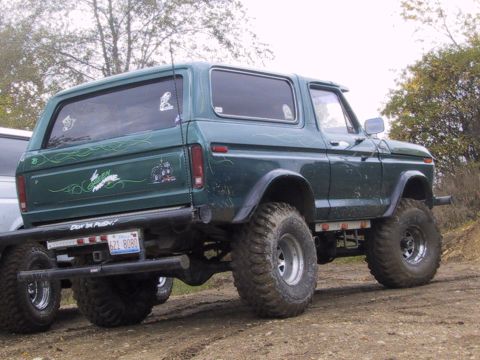 1993 Ford Bronco - This lifted Ford Bronco has custom pinstriping and a bumper sticker that reads "Don't Push!". The license plate is visible.