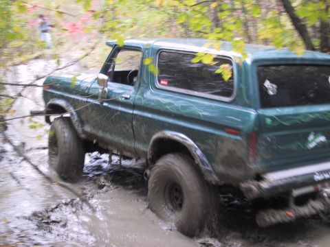 1993 Ford Bronco - This 1978 Ford Bronco is navigating a challenging muddy off-road course.
