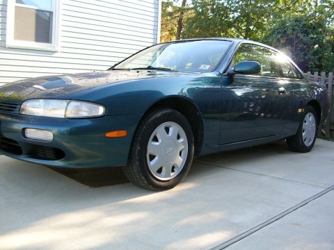 1995 Nissan 240SX - This 1995 Nissan 240SX is shown in a 3/4 front view, parked on a concrete driveway.