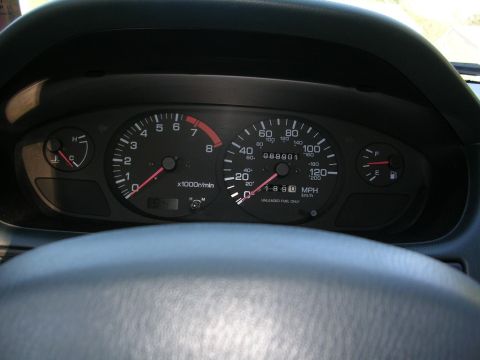 1995 Nissan 240SX - The dashboard displays the vehicle's speed, engine RPM, fuel level, and temperature.