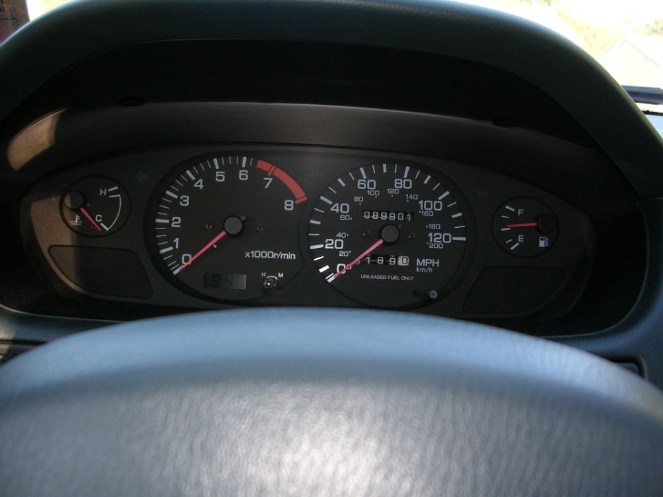 Dashboard gauges with tachometer, speedometer, fuel, and temperature gauges visible. Odometer reads 088901