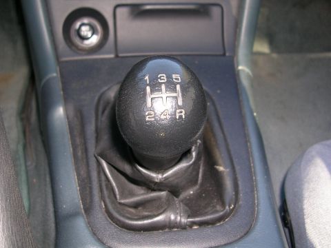 1995 Nissan 240SX - The shift knob displays the standard H-pattern for a manual transmission, including reverse.