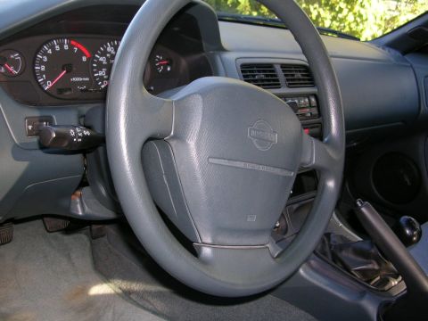 1995 Nissan 240SX - Interior view of a 1995 Nissan 240SX, the dashboard and steering wheel.