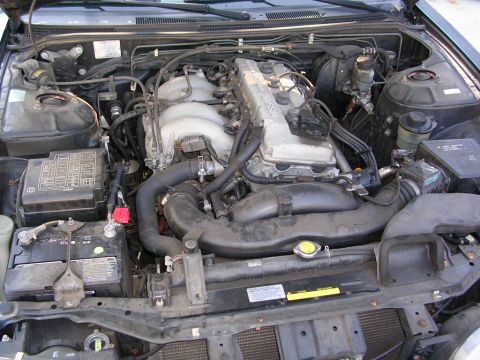 1995 Nissan 240SX - The engine bay of a 1995 Nissan 240SX, the SR20DE engine and associated components.