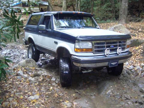 1993 Ford Bronco - This lifted Ford Bronco navigates a challenging off-road stream bed.
