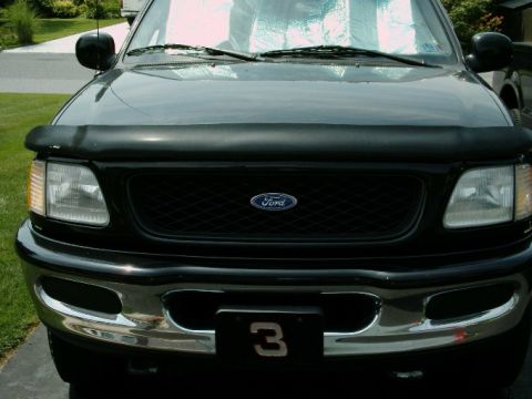 1997 Ford F-150 - Front view of a 1997 Ford F-150 pickup truck, showing the grille and headlights.