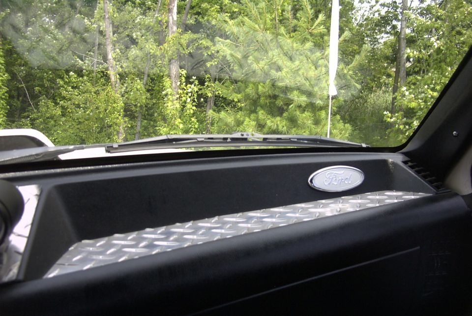 Interior view of 1991 Ford F-250 dashboard with Ford emblem and diamond plate trim
