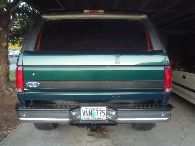 Green Ford Bronco rear view, showing a chrome bumper and Oregon license plate VNN 775