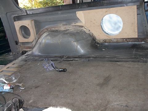 1986 Ford Bronco - Cut out the speaker holes in the MDF and remounted it on the plywood walls.