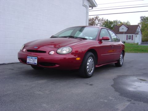 1998 Ford Taurus - This 1998 Ford Taurus is shown in a front 3/4 view, parked on asphalt.