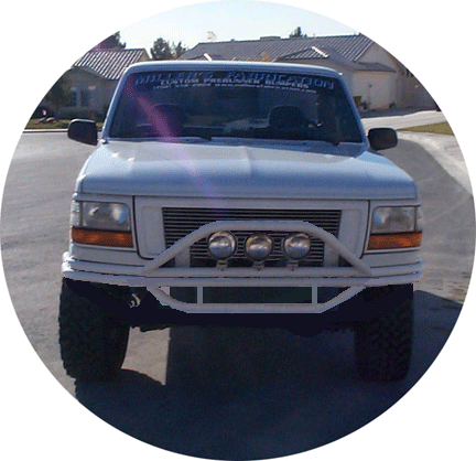 1992 Ford Bronco - This Ford F-Series truck has a custom front bumper with integrated lights.