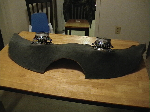 Two car speakers mounted on a dark gray, curved pod