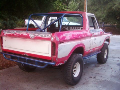 1978 Ford Bronco - This 1978 Ford Bronco is shown from the rear, a custom roll cage and bumper.