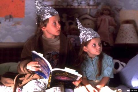 1993 Ford Bronco - Children wearing tinfoil hats appear to be reading books while sitting on a couch.