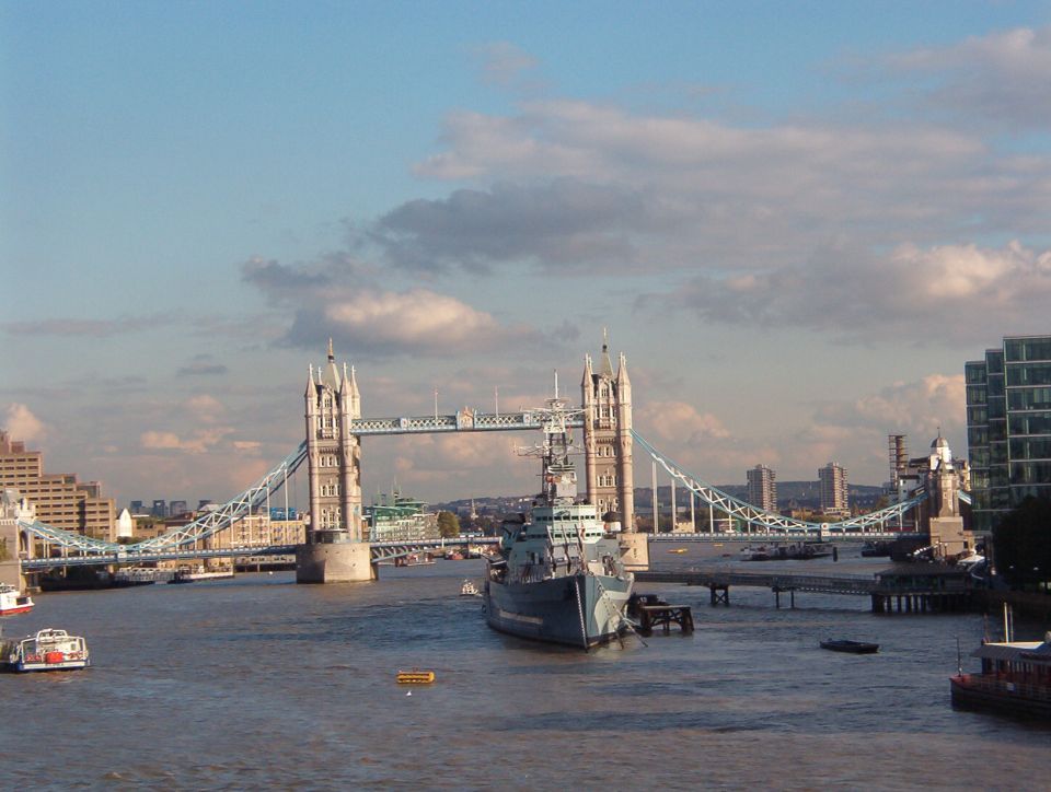 Tower Bridge over the River Thames with HMS Belfast warship moored in the foreground