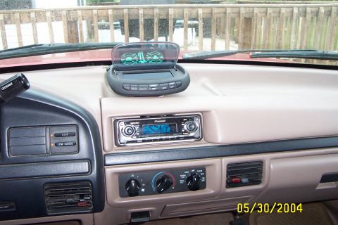 1996 Ford Bronco - The interior of a 1996 Ford Bronco shows an aftermarket Pioneer stereo and a head-up display unit mounted on the dashboard.