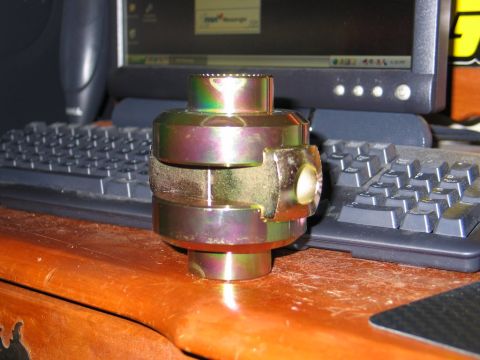 1995 Ford Bronco - A differential part is shown on a desk, with computer equipment visible behind it.