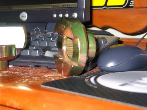 1995 Ford Bronco - Metal differential part shown on a desk with computer peripherals in the background.