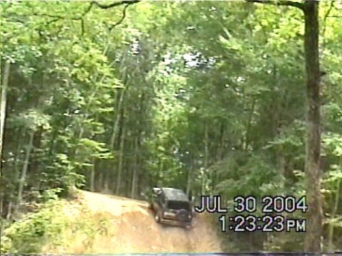 1988 Ford Bronco - 1988 Ford Bronco navigating a dirt road in a forest setting. Recorded on July 30, 2004.