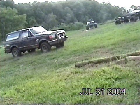 1988 Ford Bronco - 1988 Ford Bronco on a hill with ATVs in the background. Date stamp shows July 31, 2004.