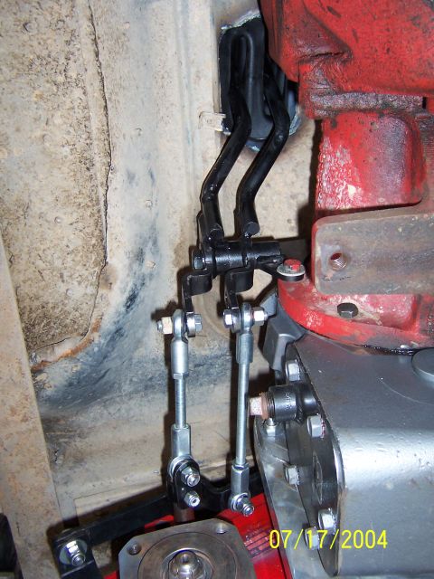 1978 Ford Bronco - The image shows a close-up view of the mechanical linkage system for a vehicle's transmission.