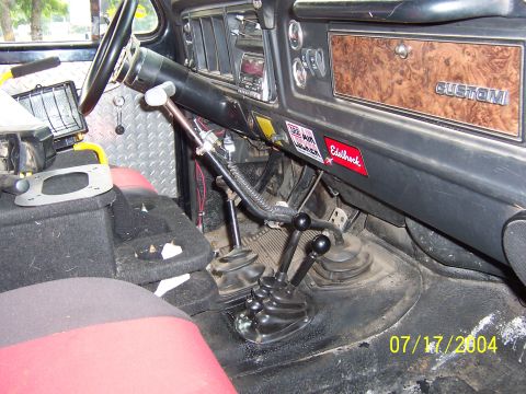1978 Ford Bronco - Interior view of a 1978 Ford Bronco, highlighting the dashboard and dual shifter setup.