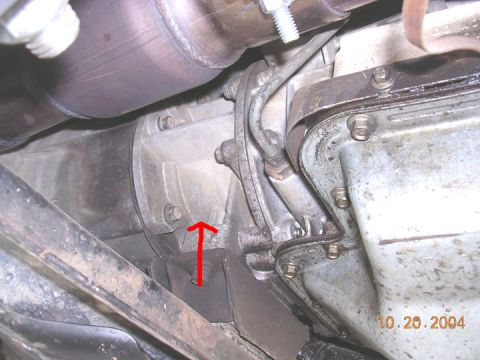1994 Ford Bronco - Close-up of vehicle undercarriage components, including transmission and exhaust, with a date stamp of 10.20.2004.