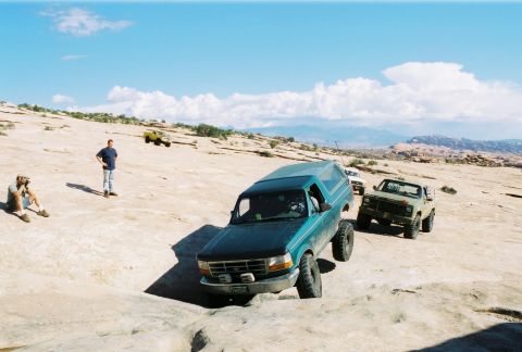 1996 Ford Bronco - Off-roading in Moab, Fall 2004, with a group of SUVs navigating the rocky landscape.