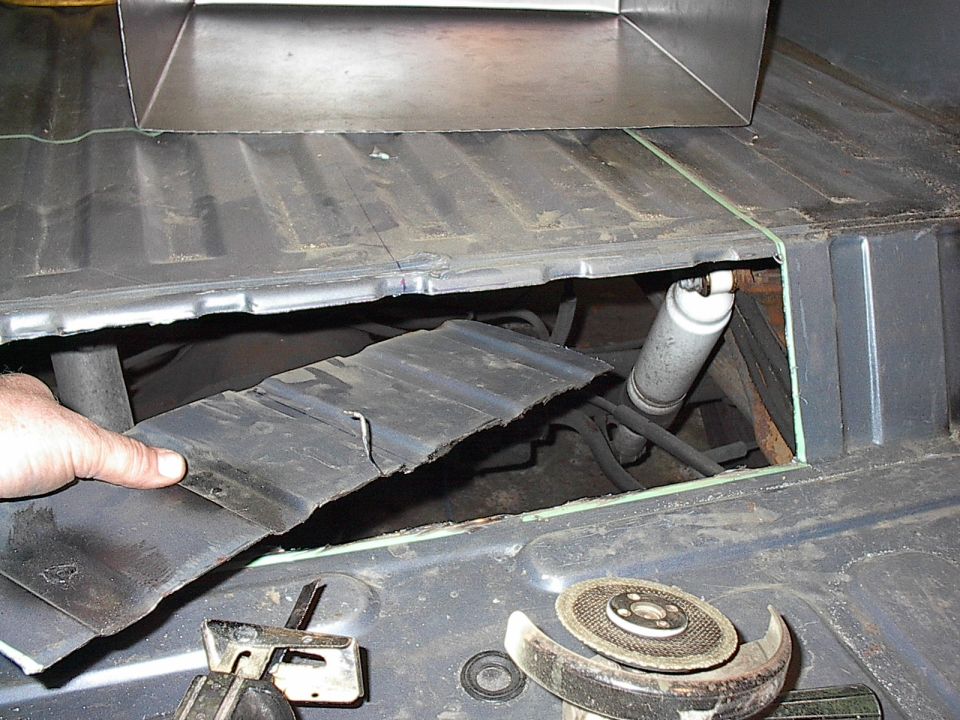 Once you remove the upright floor piece, keep it for patches later, a rust sets further in.  I ran a sanding drum around the inside edges of the opening to clean up the burrs and sharp edges.