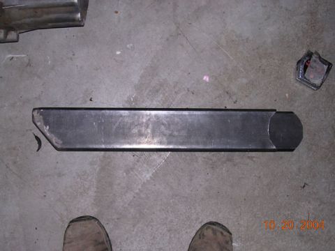 1994 Ford Bronco - Metal bracket on concrete floor with a date stamp of 10.20.2004.
