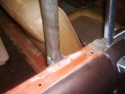 1978 Ford Bronco - Close-up view of a vehicle's interior, highlighting the installation of a roll cage.