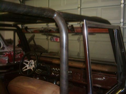 1978 Ford Bronco - Custom roll cage installed in the interior of a 1978 Ford Bronco, brown upholstery.