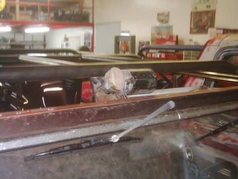 1978 Ford Bronco - The photo shows a close-up view of a vehicle's windshield wiper motor and linkage assembly.