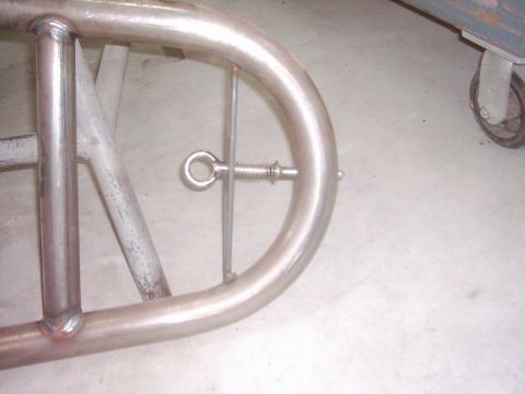 1978 Ford Bronco - Detail of a tube door frame, showing a spring-loaded pin assembly.