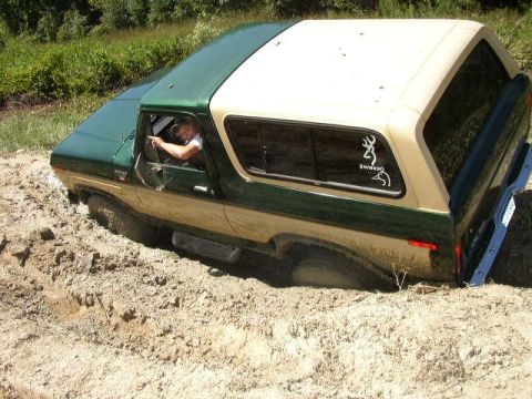1978 Ford Bronco - This 1978 Ford Bronco is deep in the mud, with the driver attempting to navigate out.