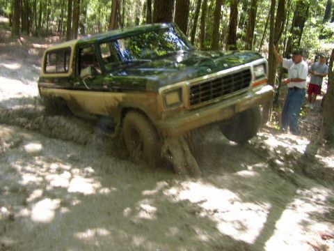 1978 Ford Bronco - Ford Bronco tackles a challenging muddy off-road course.