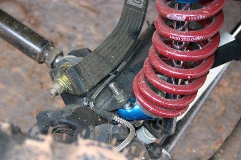 1993 Ford Bronco - This image shows a close-up view of off-road suspension parts, including a red Eibach coilover shock absorber.