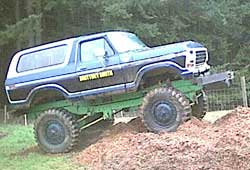 1993 Ford Bronco - This lifted Ford Bronco is being transported on a trailer chassis, giving it extreme height.