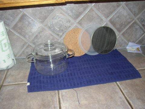 1987 Volkswagen Golf - Kitchen counter scene with cookware and coasters.