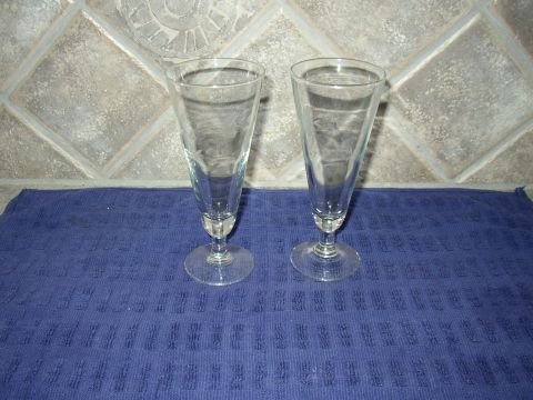 1987 Volkswagen Golf - Two tall clear glasses are placed on a blue towel in front of a tiled wall.
