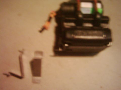 1978 Ford Bronco - Heater core and associated parts are laid out on a surface.