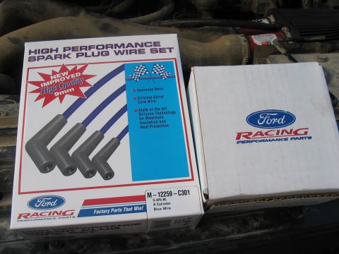 1988 Ford Bronco - Two boxes of Ford Racing performance parts are shown, one for a spark plug wire set.