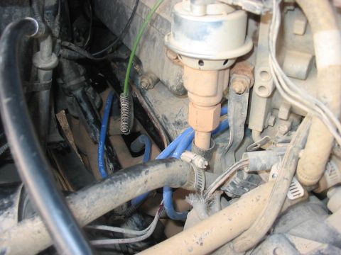 1988 Ford Bronco - Engine compartment detail showing a distributor and associated wiring.