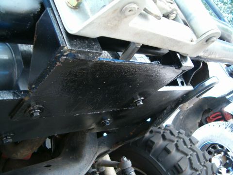 1979 Ford Bronco - Close-up of the undercarriage, showing a skid plate and part of a tire.