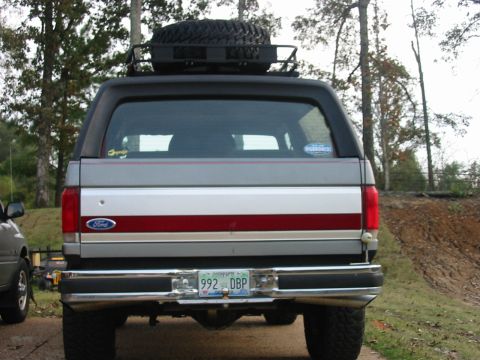 1991 Ford Bronco - Rear view of spare tire mounted in roof rack.