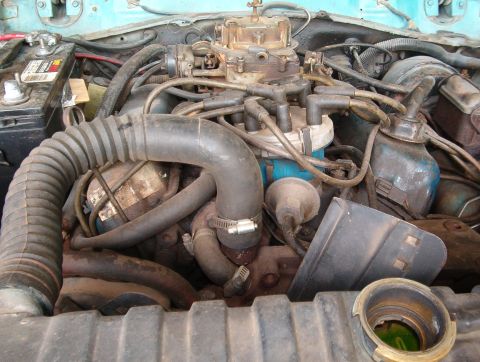 1977 Ford Mustang II - Close-up view of a vehicle's engine bay, showing various components and wiring.
